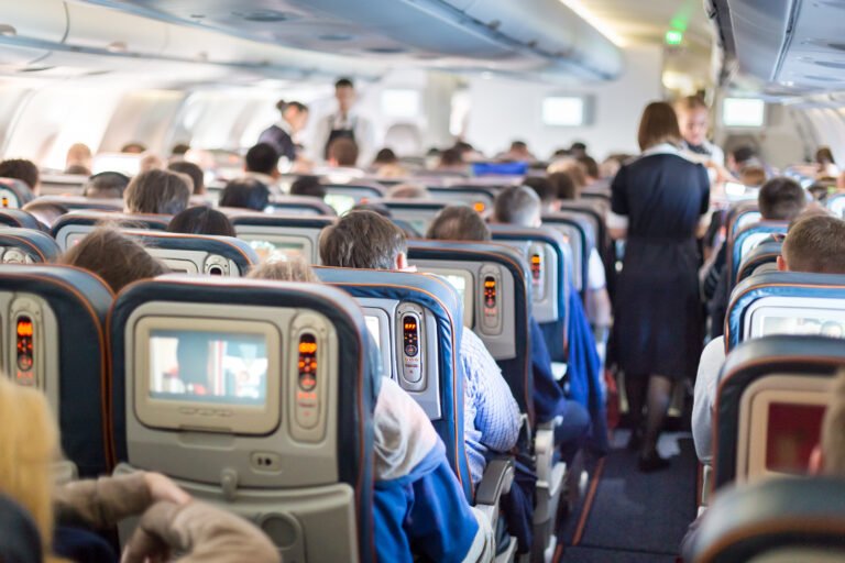 Dad sparks debate holding daughter’s head 45 mins while she slept on flight
